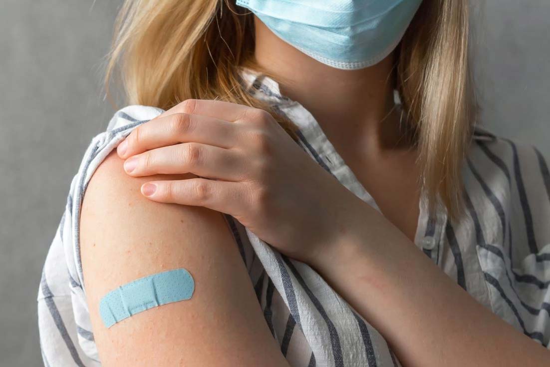Woman with a Band-Aid on her arm